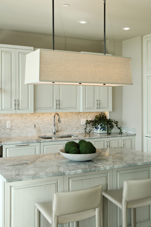 White Fantasy with Light Gray Glazed Sea Pearl Cabinets and Carrara Marble Matchstick Backsplash